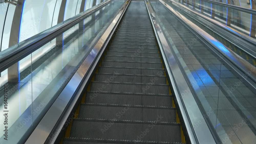 Panning shot of escalator in shopping center