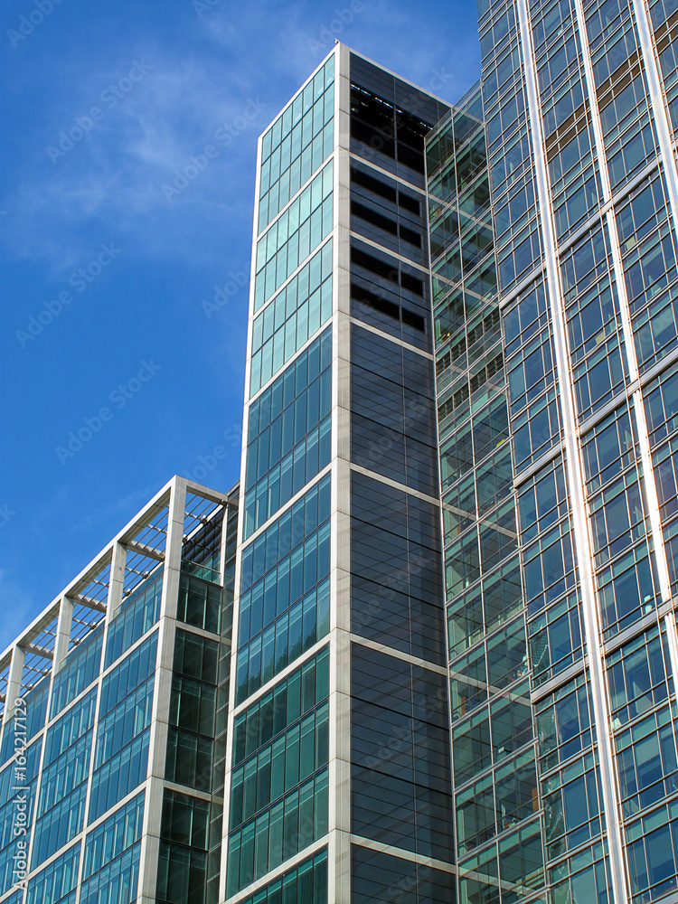 Modern glass skyscraper in Canary Wharf at London's Docklands Modern glass skyscraper in Canary Wharf at London's Docklands