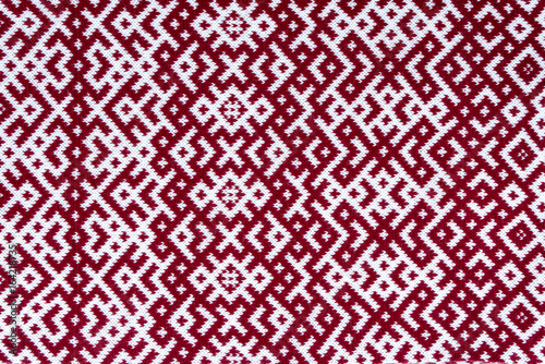 Knitted texture with the pattern of National symbol of Latvia - Lielvardes (place in Latvia) belt that is one of the most magnificent Latvian symbols. Latvian traditional historical ornaments.