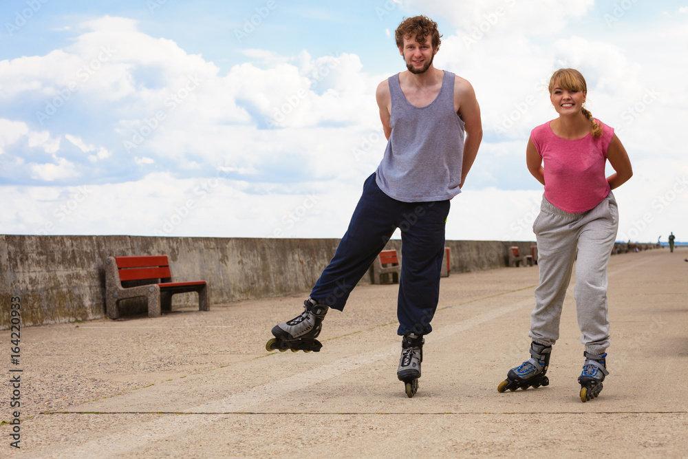 Young people casually rollblading together. Young people casually rollblading together.
