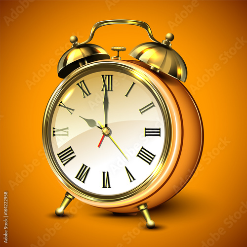Orange retro style alarm clock on orange background.