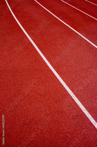 Red running track Synthetic rubber on the athletic stadium. © Fotoglee