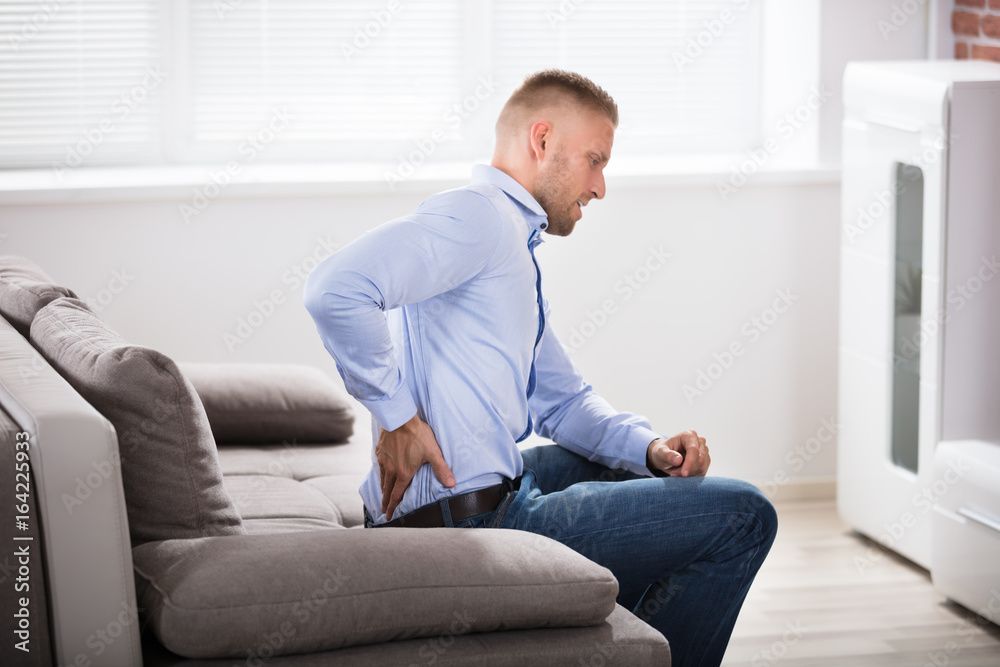 Man Suffering From Back Pain Man Suffering From Back Pain