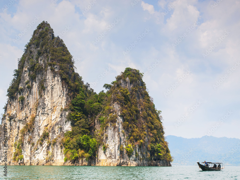 Obraz premium Karst limestone rock outcrops in the ocean, Khao Sok National Park, Thailand