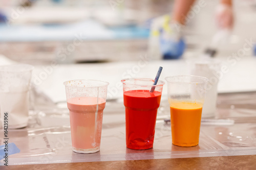 different colour paint in bottles closeup