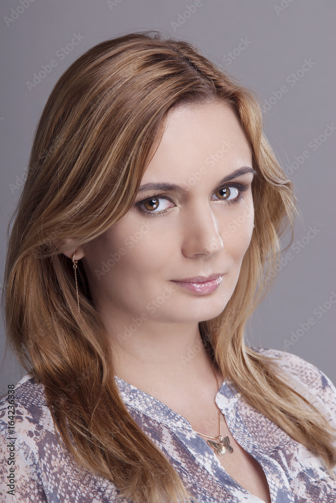 Girl with clean skin isolated on grey background closeup. Girl with clean skin isolated on grey background closeup.