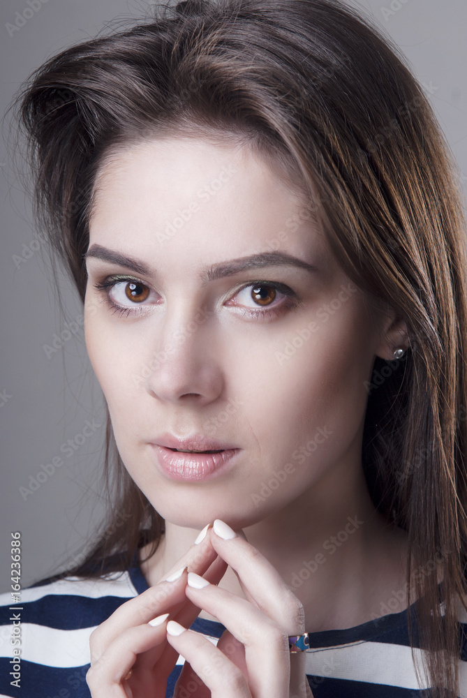 © pushann - Brunette girl with clean skin closeup. Isolated grey background. © pushann - Brunette girl with clean skin closeup. Isolated grey background.