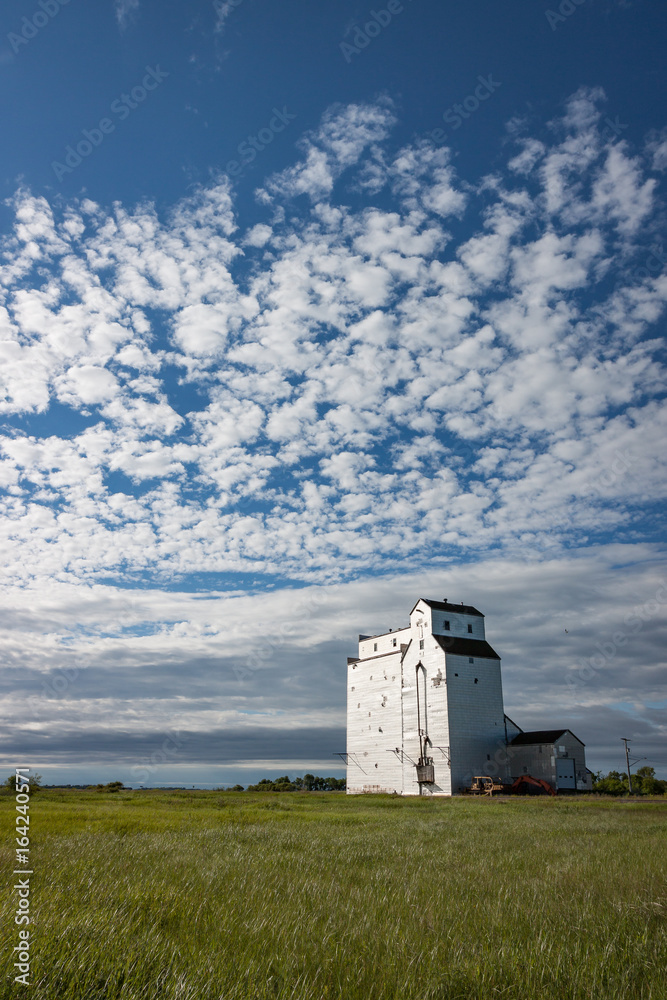 White Wooden Grain Elevator Under Gorgeous Blue Sky White Wooden Grain Elevator Under Gorgeous Blue Sky