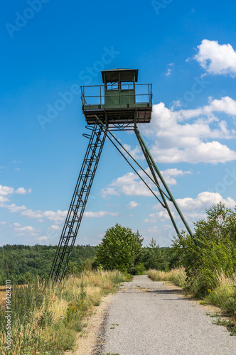 Remains of iron curtain with watchtower