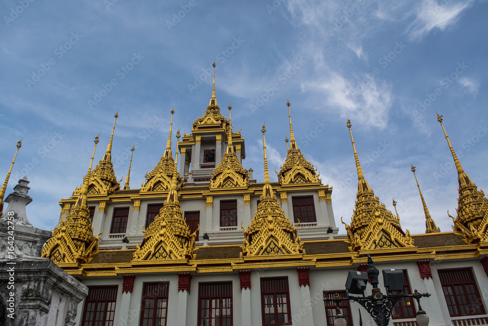 Loha Prasat Wat Ratchanatdaram in Bangkok Thailand which means iron castle or monastery is composes of five towers, of which the outer, middle and the center tower contain large black iron spires. 