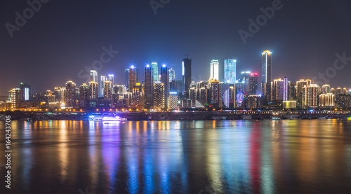 City Skyline By River Against Sky at night in city of China.