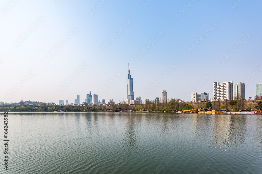 City Skyline By River Against Sky in city of China.
