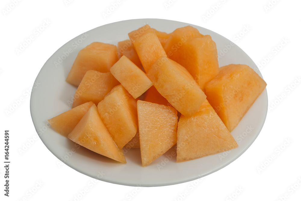 Fresh sweet cantaloupe on a plate, isolated on white background. Fresh sweet cantaloupe on a plate, isolated on white background.