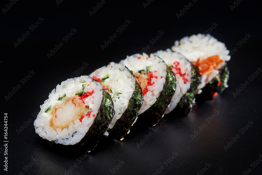 Sushi on black background. Perfect for creating sushi restaurant menu. Part of series. Sushi on black background. Perfect for creating sushi restaurant menu. Part of series.