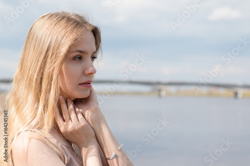 Girl with blond hair on the promenade