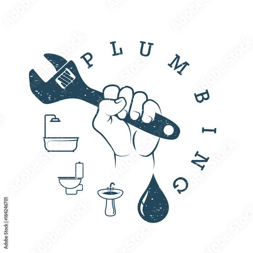 Wrench in hand for plumbing repair
