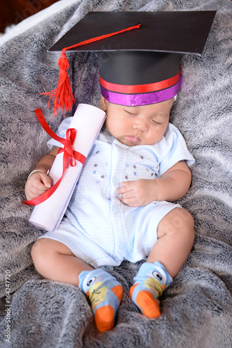 The infants in the graduation kit convey the hope of the family.