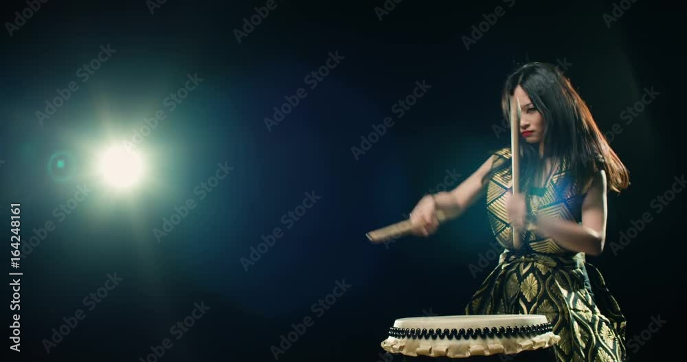 epic performance beautiful Asian girl drummer Taiko , makes the rhythm, Slow motion