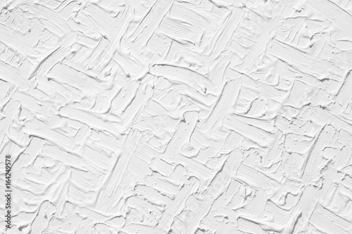 Texture of white color with a natural pattern. The background is painted with colors with a volumetric pattern.