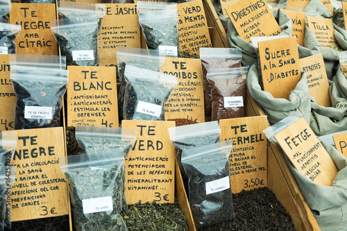 Market counter with many herbs