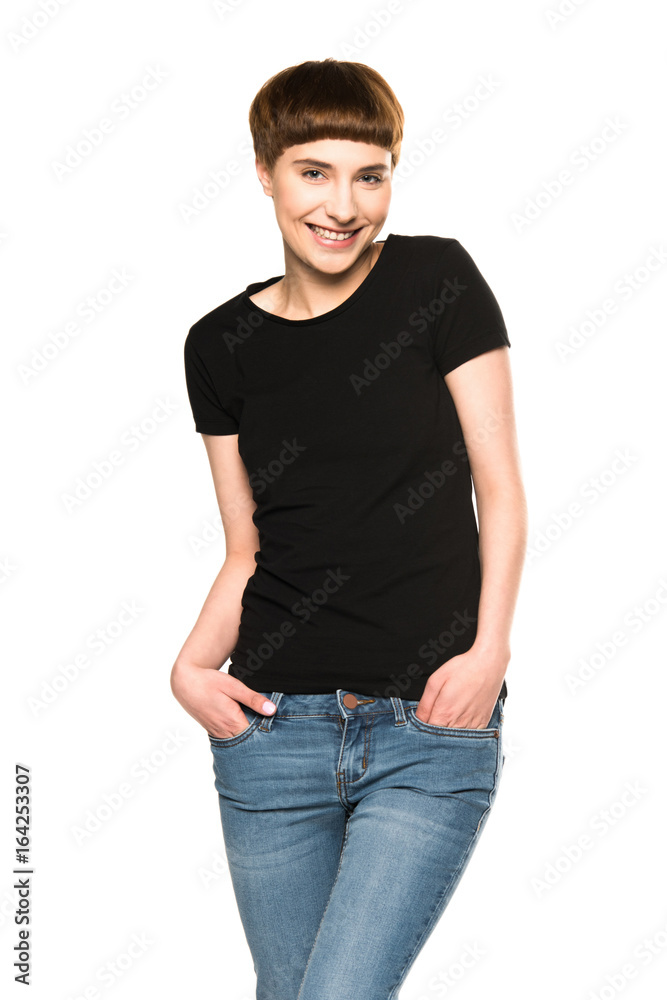 smiling young woman standing with hands in pockets, isolated on white smiling young woman standing with hands in pockets, isolated on white