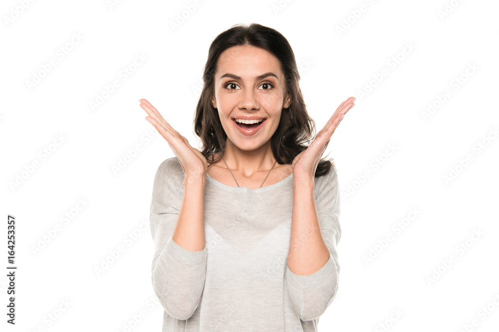 attractive excited woman standing in casual clothes, isolated on white attractive excited woman standing in casual clothes, isolated on white
