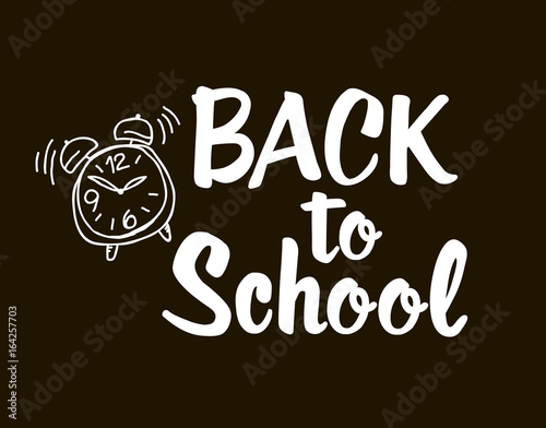 Back to school - lettering calligraphy phrase, handwritten text isolated on the black background. Fun calligraphy for typography greeting and invitation card or t-shirt print design.