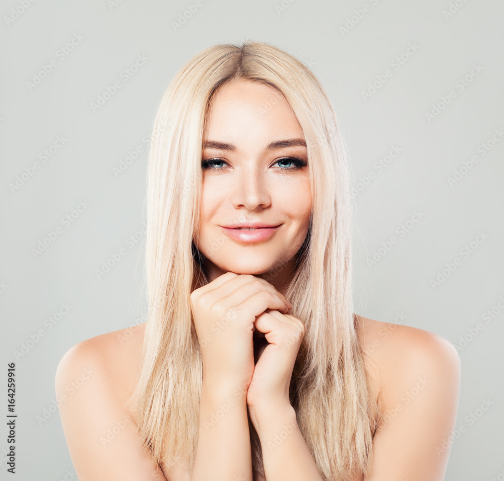 Smiling Spa Woman with Blonde Hair. Blondie Fashion Model with Shiny Skin and Natural Makeup Smiling Spa Woman with Blonde Hair. Blondie Fashion Model with Shiny Skin and Natural Makeup