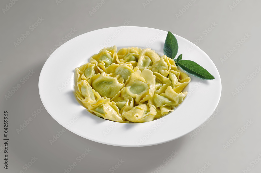 Dish of ravioli with butter and sage