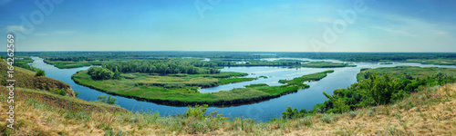 Summer colorful landscape on delta of the river Vorskla from the hill. © olegphotor