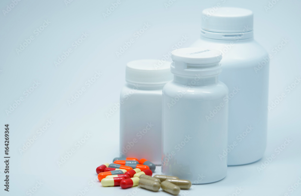 Capsule pills with closed bottle on white background Capsule pills with closed bottle on white background