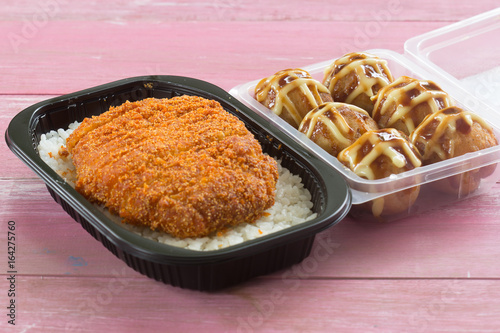 fried pork topped on rice  (tonkatsu) and Tako Yaki on Box photo