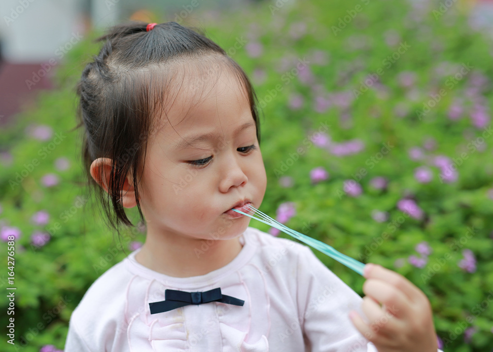 Cute little girl enjoy eating bubble gum. Cute little girl enjoy eating bubble gum.