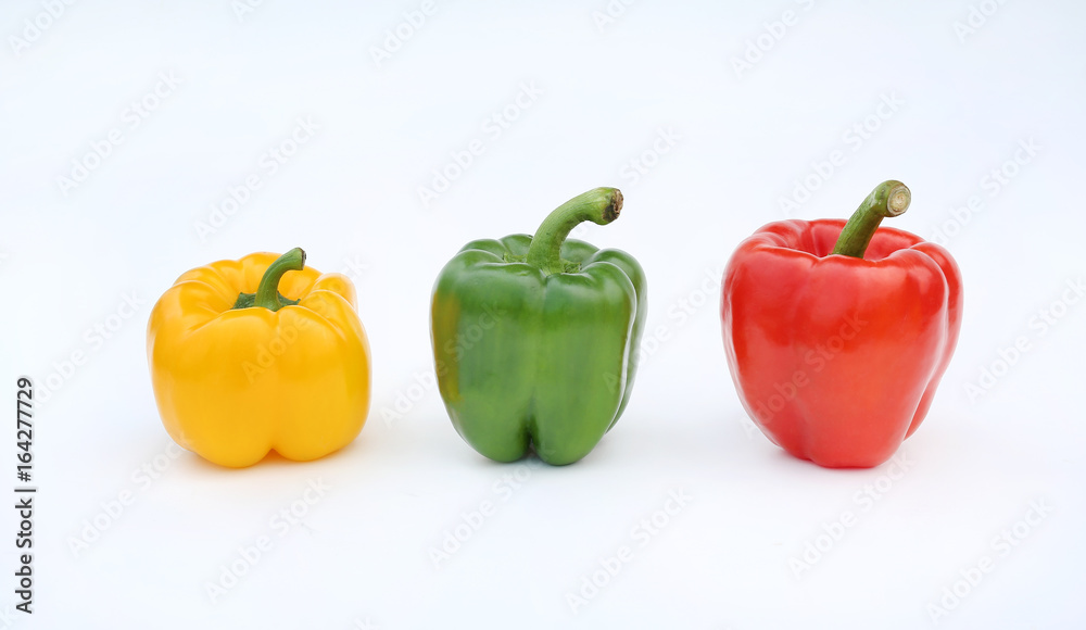 Green, red and yellow bell pepper isolated on white background. Green, red and yellow bell pepper isolated on white background.