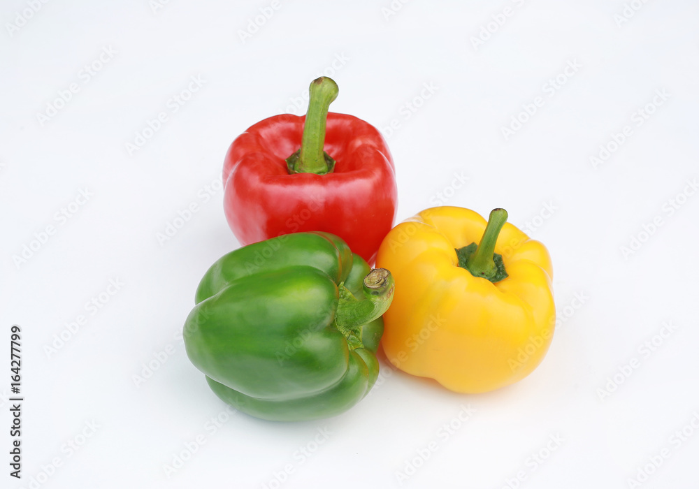 Green, red and yellow bell pepper isolated on white background. Green, red and yellow bell pepper isolated on white background.