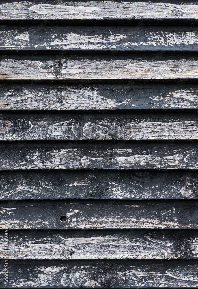 Close up detail on faded and decaying wooden window shutters Close up detail on faded and decaying wooden window shutters