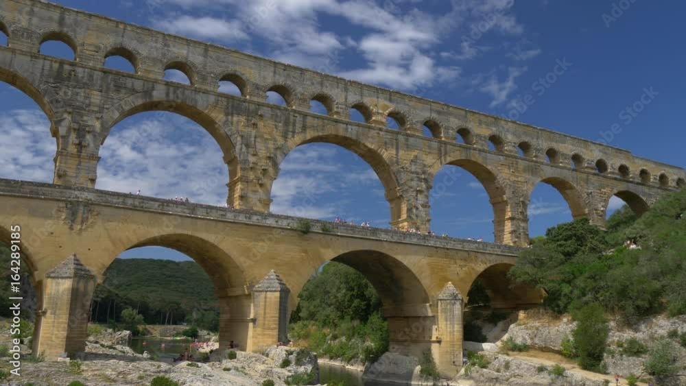 Three-tiered aqueduct Pont du Gard on the river Gardon. Provence, France Three-tiered aqueduct Pont du Gard on the river Gardon. Provence, France