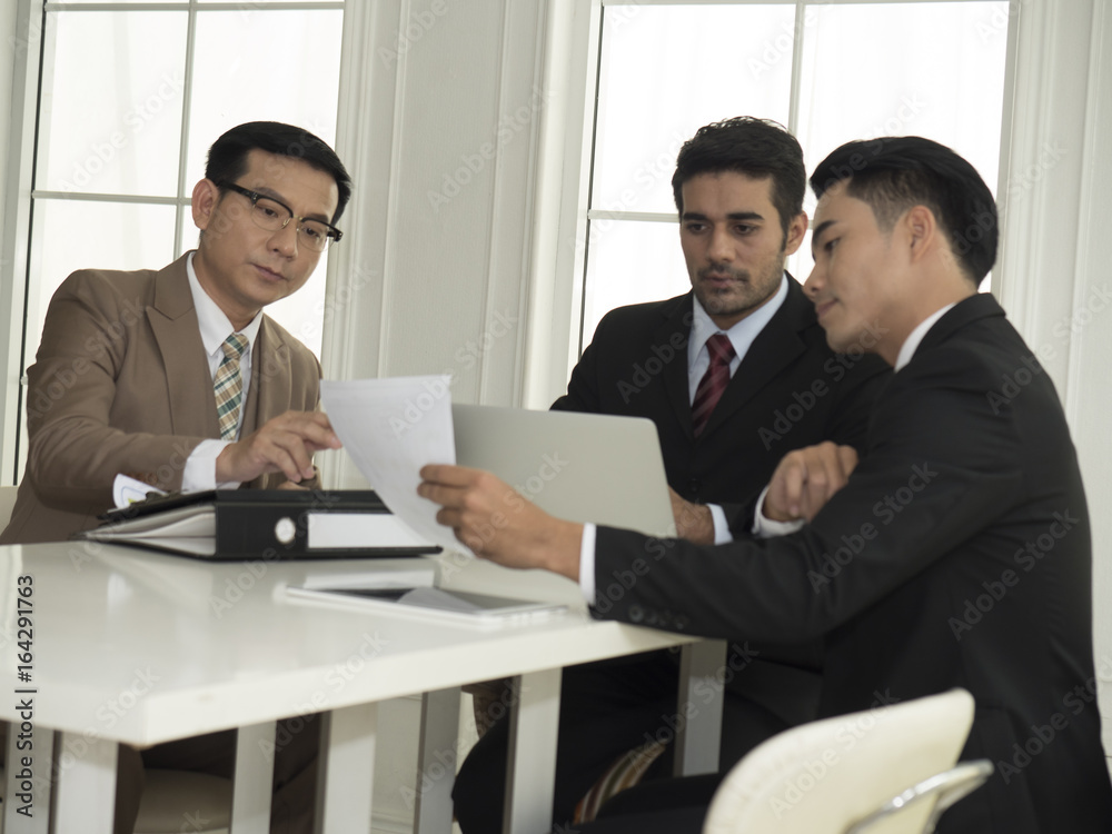 Business team meeting working with new startup project.discussion and analysis data the charts and graphs. Digital tablet laptop computer using,Business finances and accounting concept.