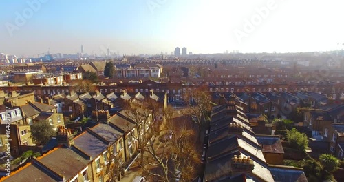 Aerial view over a London district showing residential housing, as well as commercial and industrial buildings.