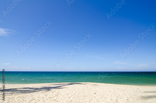 tropical sandy beach at sunny day.blue sky and torquise sea water. ideal for travel and vacation background