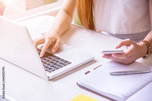 A young business woman using laptop computer.