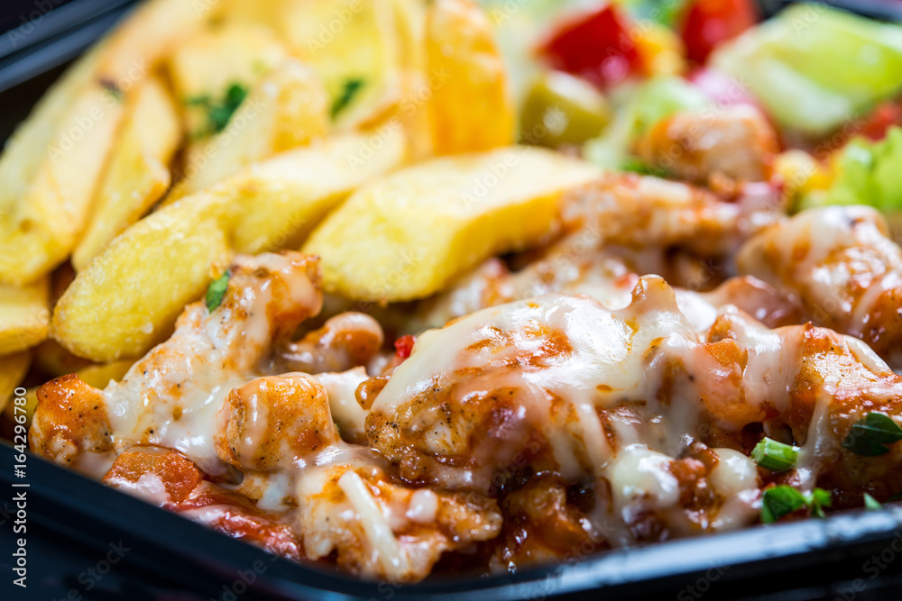 Fresh chicken steak with tomatoes and french fries