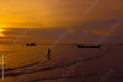 people on the beach during sunset time or silhouette © nutraveller