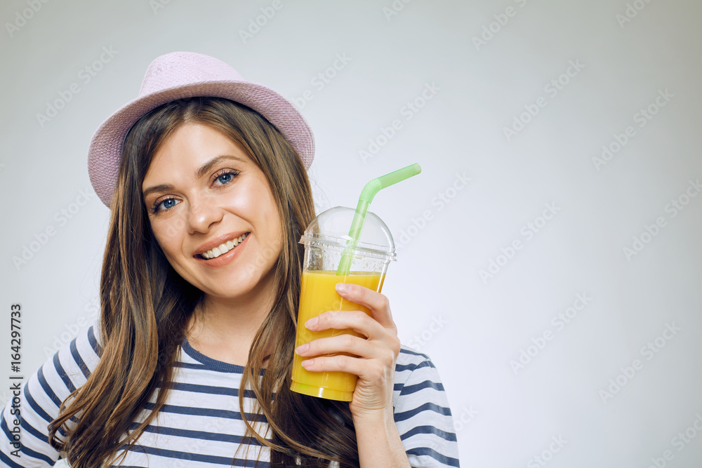 Portrait of smiling woman drinking orange juice. Portrait of smiling woman drinking orange juice.
