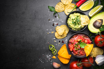 Latinamerican food party sauce guacamole, salsa, chips and ingre