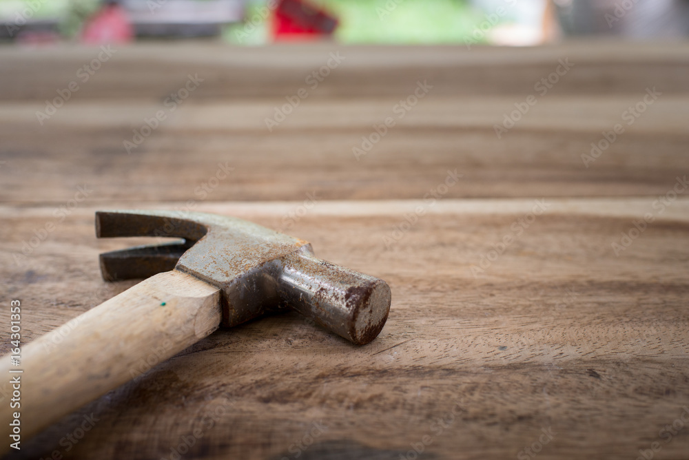 Old hammer on wood