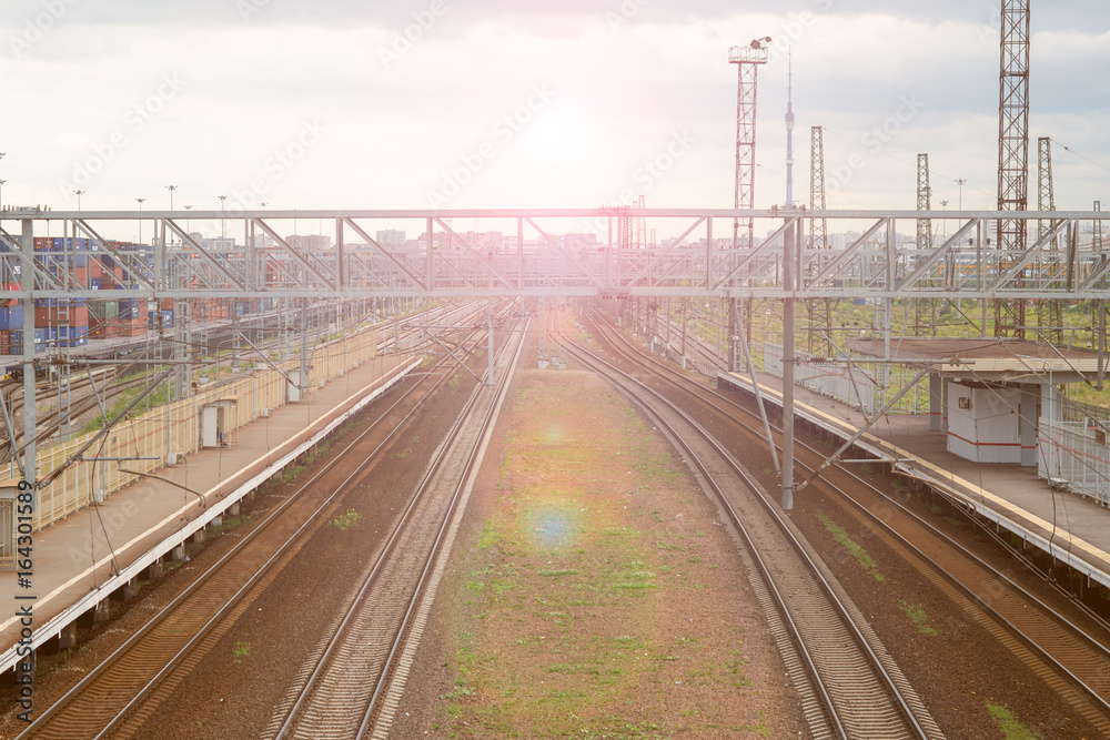 the sun shines on the railway at sunset the sun shines on the railway at sunset