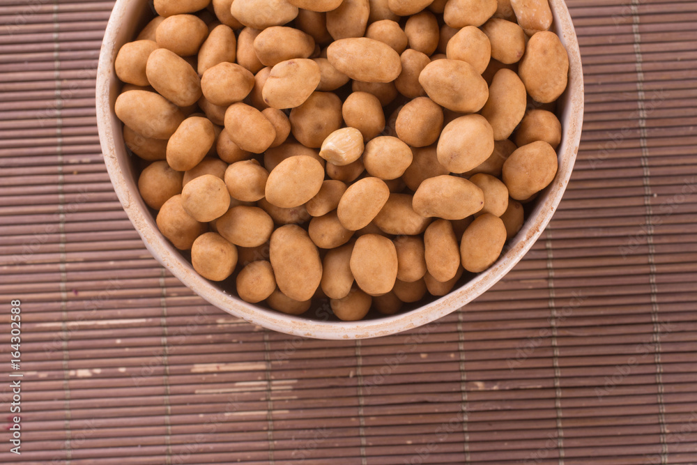 Japanese Peanuts into a bowl Japanese Peanuts into a bowl
