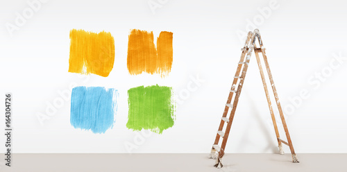 painter ladder with paint colors samples, isolated on blank white wall background, web banner