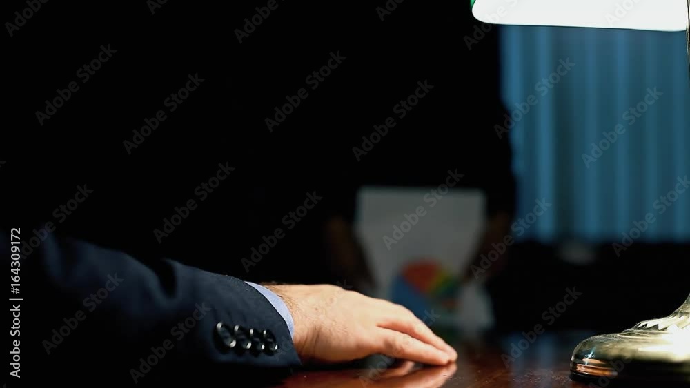 The hand of the boss grabs a sheet of paper and examines it, while the employee stands still in front of him.
The hand of the boss grabs a sheet of paper and examines it, while the employee stands still in front of him.